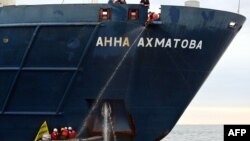 Greenpeace activists attach themselves to the anchor of the Russian passenger ship, "Anna Akhmatova," in the Barents Sea on August 27.