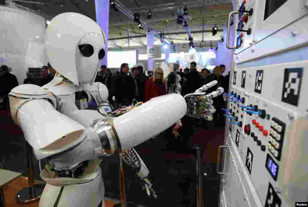 The humanoid robot AILA (artificial intelligence lightweight android) operates a switchboard during a demonstration by the German research center for artificial intelligence at the CeBit computer fair in Hanover. (Reuters/Fabrizio Bensch)