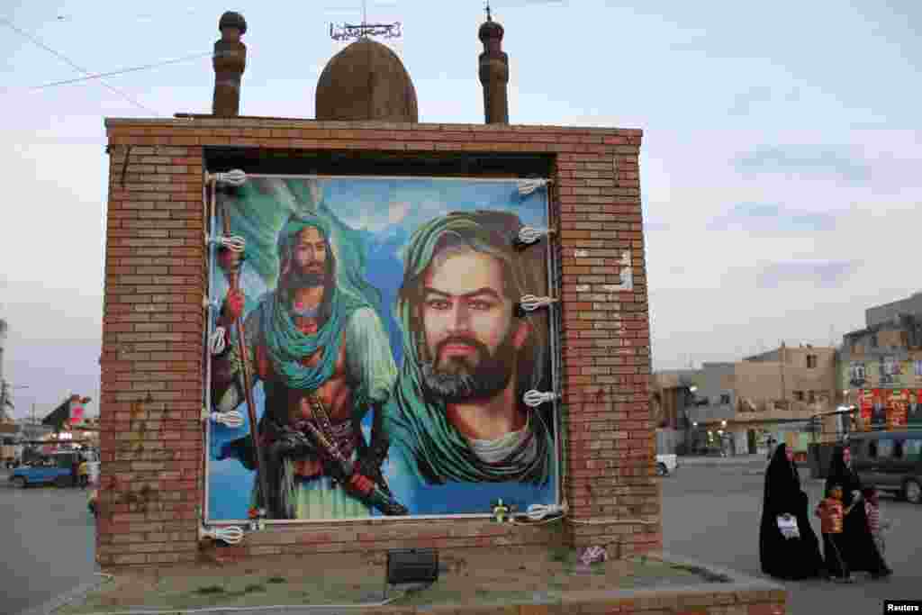 A poster depicts Imam Hussein (right) and Imam Abbas, major figures in Shi&#39;ite Islam.