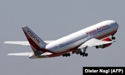 An airliner takes off after participating in a prisoner swap at Vienna International Airport on July 9, 2010.