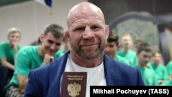 Jeff Monson poses with his Russian passport in Patriot Park outside Moscow in June 2018.