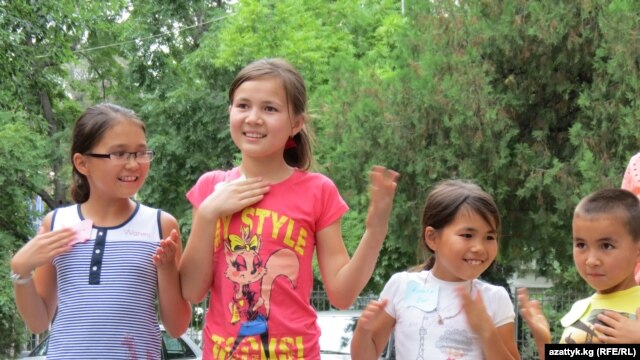 Kyrgyzstan -- Game station in park, children, Bishkek, August 2, 2013.