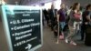 MIAMI, FL - MARCH 04: Passengers wait in line to use the Automated Passport Control Kiosks set up for international travelers arriving at Miami International Airport on March 4, 2015 in Miami, Florida. 