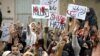 Shi'ite Muslims protest on February 18 against a bombing that killed 89 people in Quetta two days earlier. Some are questioning if the authorities are able, or even willing, to stop those behind it and other attacks.