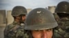 FILE: Afghan National Army soldier at an outpost in Maiwand district in the southern province of Kandahar.