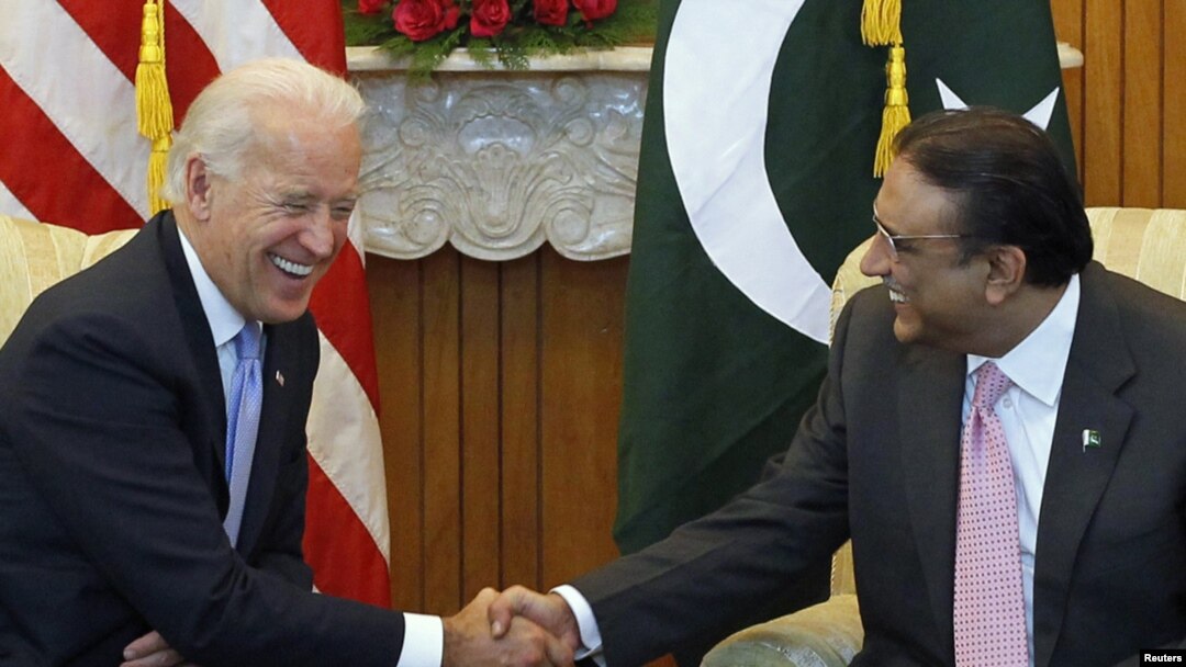 U.S. Vice President Joe Biden (left) shares a laugh while sitting down to meet with Pakistan's President Asif Ali Zardari in Islamabad
