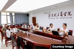 Era Kernaja (right), a 24-year-old from northern Albania, now studies computer science at Kunming University of Science and Technology.