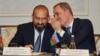 Azerbaijani Foreign Minister Jeyhun Bayramov whispers in the ear of his Armenian counterpart, Ararat Mirzoyan, during a meeting about the Trump Route for International Peace and Prosperity (TRIPP) in New York on September 23. 