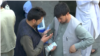 Afghanistan - money exchange - video on economic collapse - Reuters