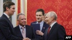 Russia's President Vladimir Putin (right) greets US special envoys Steve Witkoff (second left) and Jared Kushner (left) prior to their talks in Moscow on September 5. 