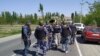 Police and military personnel on high alert in the Kyrgyz village of Kok-tash on April 29. 