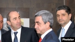 Armenia - Outgoing President Robert Kocharyan (L), President-elect Serzh Sargsyan (C) and Central Bank Chairman Tigran Sarkisian attend the inauguration of a commercial bank headquarters in Yerevan, 4Apr2008.