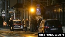 Police officers gather outside the Iranian ambassador's residence in Vienna where a 26-year-old Austrian was shot dead after he attacked a guard with a knife late on March 11. 