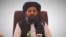 Mullah Abdul Ghani Baradar at peace talks between the Afghan government and the Taliban in Doha in July. 