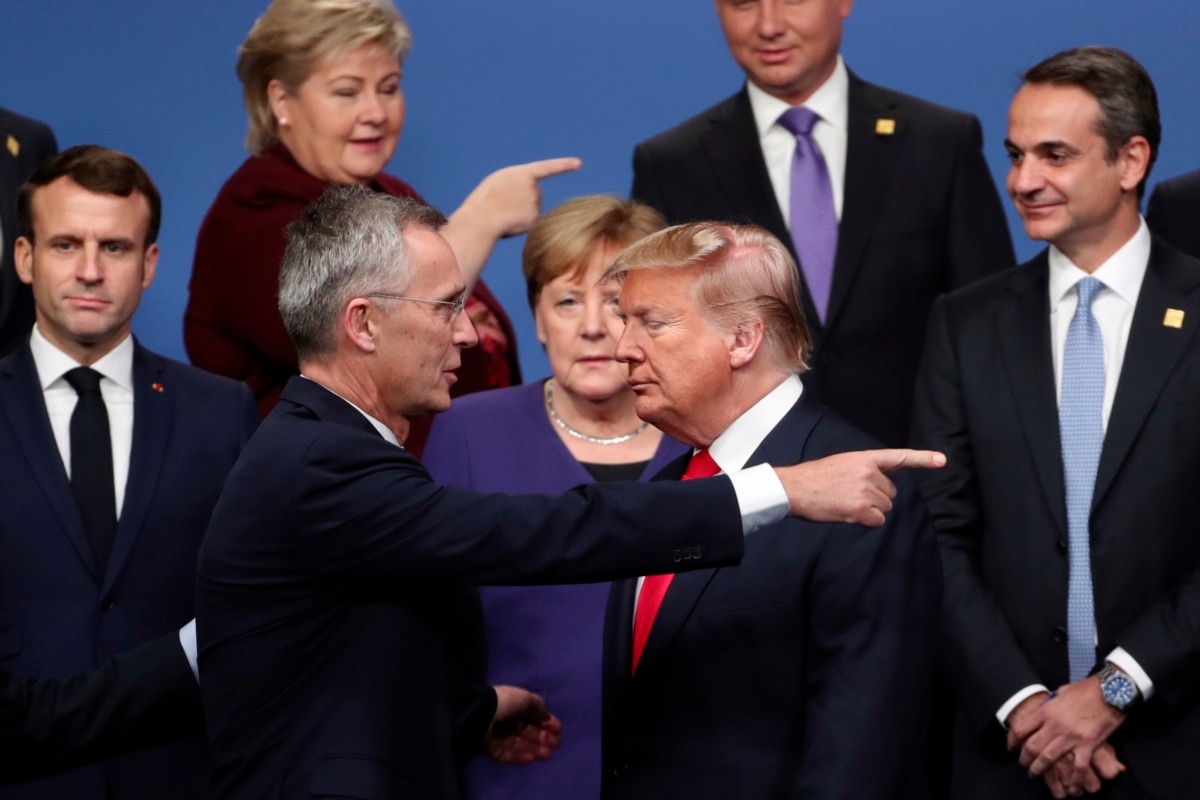 U.K. -- NATO Secretary-General Jens Stoltenberg, front left, speaks with U.S. President Donald Trump, front right, after a group photo at a NATO leaders meeting at The Grove hotel and resort in Watford, Hertfordshire, December 4, 2019