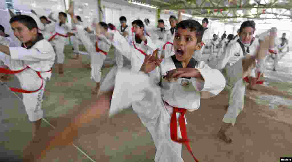 Syrian refugee children undergo training in the Korean Taekwondo Academy For Syrian Children at the Al-Zaatari refugee camp in the Jordanian city of Mafraq, near the border with Syria, on March 24. (Reuters/Muhammad Hamed)