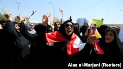 Iraqi women shout slogans during a protest in Basra, Iraq September 7, 2018