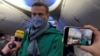 Aleksei Navalny on board a plane in Berlin before his departure for Moscow on January 17