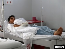 A wounded Afghan man receives treatment at the Emergency Hospital in Kabul.