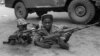 Uganda -- National Resistance Army children soldiers pose with their kalashnikov, 31 January 1986 in Kampala