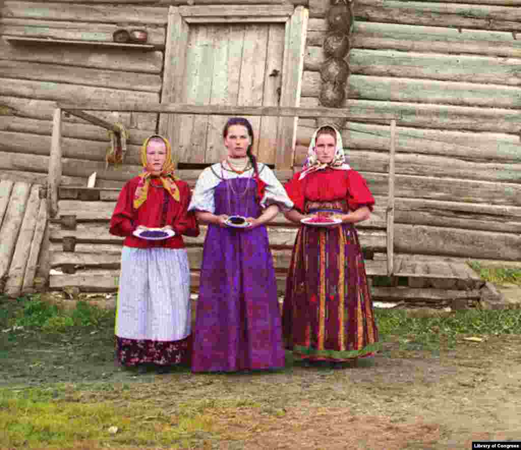 Young Russian women offer berries to visitors outside their izba, a traditional wooden house, near the Sheksna River. - Photos and caption information courtesy of the Library of Congress.