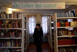 Valentina Minina runs the library in the village of Gorka-Rudakovskaya.
