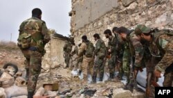 Syrian pro-government troops hold a position as they advance against rebel forces in east Aleppo this week. 