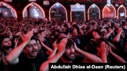 Shi'ite Muslim pilgrims gather as they commemorate the Arbaeen outside of Imam al-Hussein shrine in Karbala, Iraq, November 10, 2017