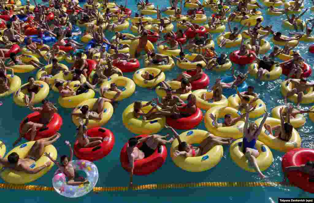 Swimmers cool down at the Dreamland aquapark in Minsk, Belarus. (epa/Tatyana Zenkovich)