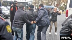 A Musavat Party member is arrested for protesting outside the Baku city hall.