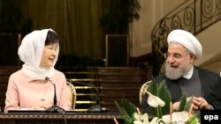 Iranian President Hassan Rohani (R) and South Korean President Park Geun-hye attend a press conference in Tehran, May 2, 2016, at the height of their post-nuclear-deal trade relations. FILE PHOTO