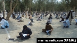 Afghan students take an entrance exam for a Laghman Province technical school. Access to higher education is extremely limited in Afghanistan.
