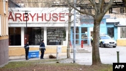 Swedish police cordon off the area outside the Varby Gard metro station in Stockholm where two people were injured in an explosion on January 7. 