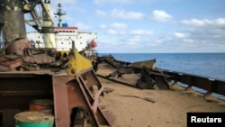 A civilian cargo vessel carrying Ukrainian grain is seen after it was hit by a Russian missile on September 12 in the Black Sea. 