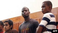 Michael Adebolajo (center) is seen in a 2010 photo that shows him in Kenyan custody.