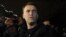 Aleksei Navalny speaks to journalists and supporters outside a police station in Moscow in December 2011.