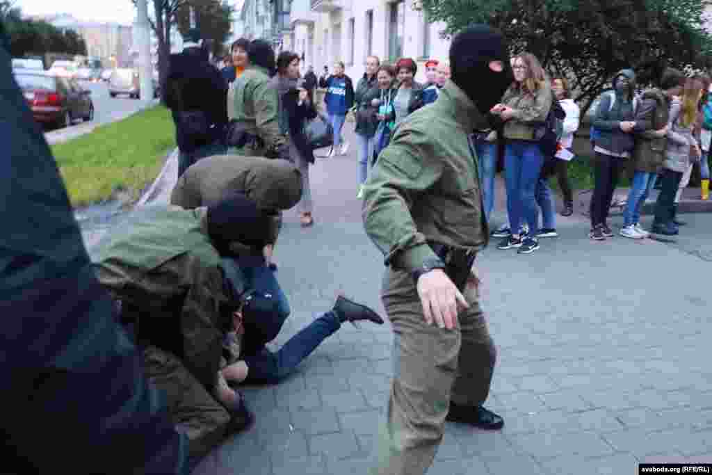 Many protesters were forced to the ground and restrained by police.