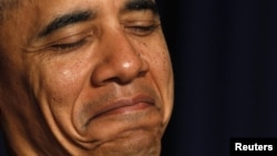 U.S. -- President Barack Obama listens during the 60th annual National Prayer Breakfast in Washington, DC, 02Feb2011