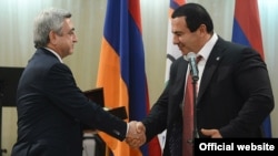 Armenia - President Serzh Sarkisian and businessman Gagik Tsarukian shake hands during an awards ceremony,26Dec,2012.