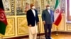 FILE: Afghan foreign minister Hanif Atmar with his Iranian counterpart Jawad Zarif in Tehran.