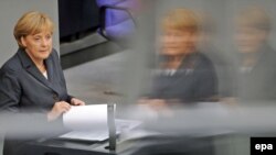 German Chancellor Angela Merkel delivers a government policy statement on Afghanistan to the Bundestag in Berlin on September 8.