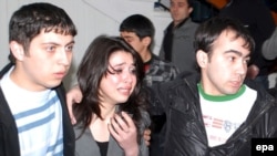 Students at the scene of the April 30 rampage on the campus of the State Oil Academy in Baku