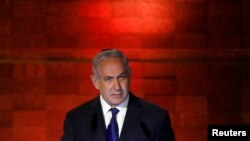 Israel's Prime Minister Benjamin Netanyahu speaks during the opening ceremony of the annual Israeli Holocaust Memorial Day at the Yad Vashem World Holocaust Remembrance Center in Jerusalem, April 11, 2018. 