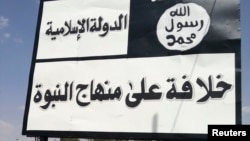An Islamic State sign along a street in Mosul.