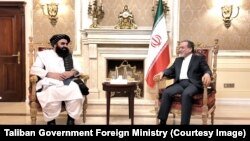 عراقچي له متقي سره د ملاقات په حال کې 