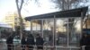 Armenian police guard a kiosk under construction in Yerevan's Mashtot Park.