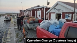 Fishing nets donated to Ukraine being collected in the Swedish village of Gislov.