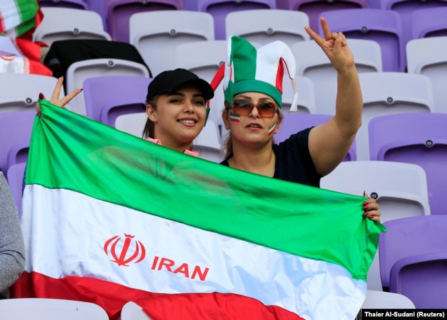 Iranian fans pose before the 2019 AFC Asian Cup semifinal match between Japan and Iran in the United Arab Emirates in January.