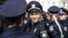 Police officers wait before an oath-taking ceremony in Kyiv on July 4.