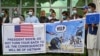 Afghan former interpreters for U.S. and NATO forces gather during a demonstration in downtown Kabul on April 30.